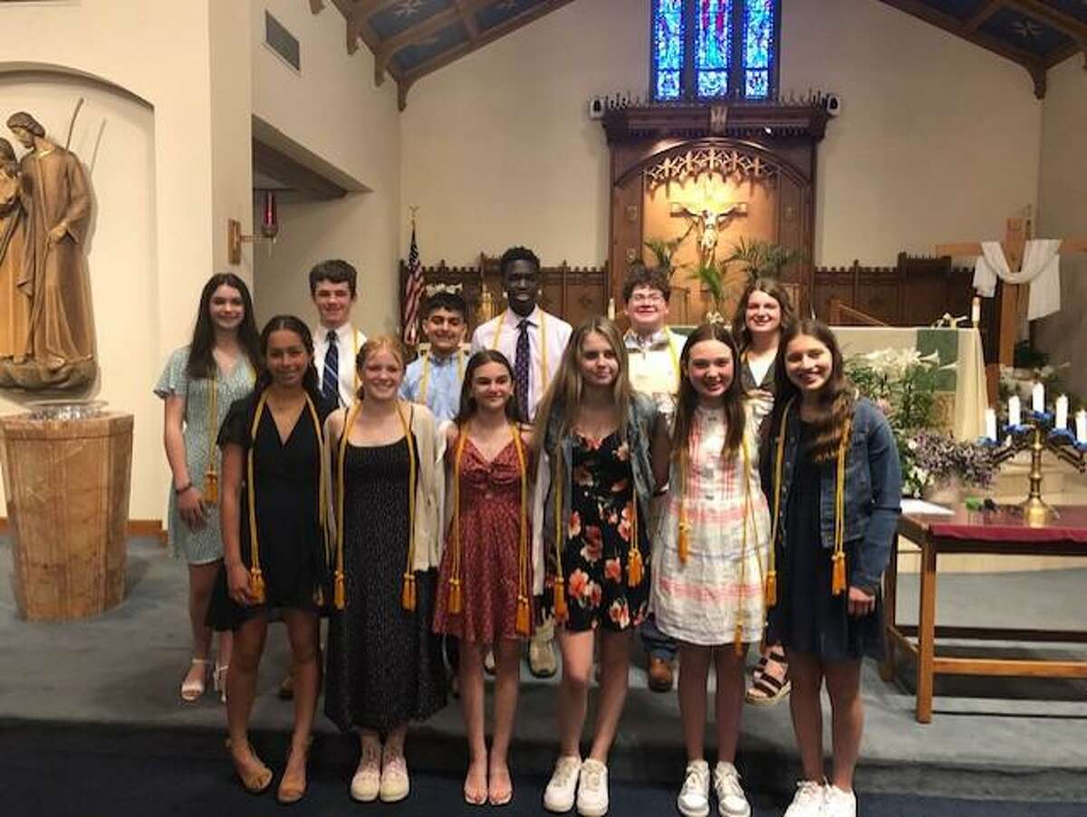 St. Mary School inducted 15 new members into the National Junior Honor Society - St. Mary School Milford Chapter in St. Mary Church of Precious Blood Parish on April 28, 2022.