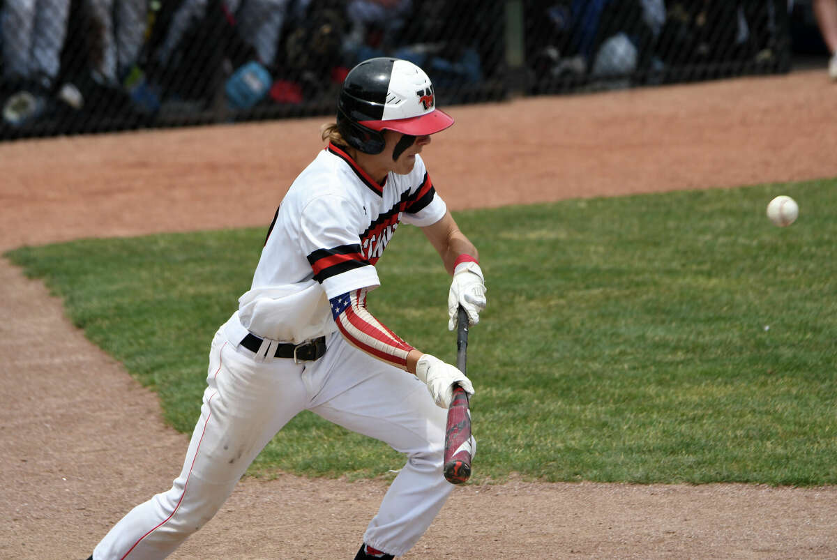Fairfield Warde's Griffin Polley bunts home a run during the Class LL baseball championship game between Fairfield Warde and Southington at Palmer Field, Middletown on Saturday, June 11, 2022.