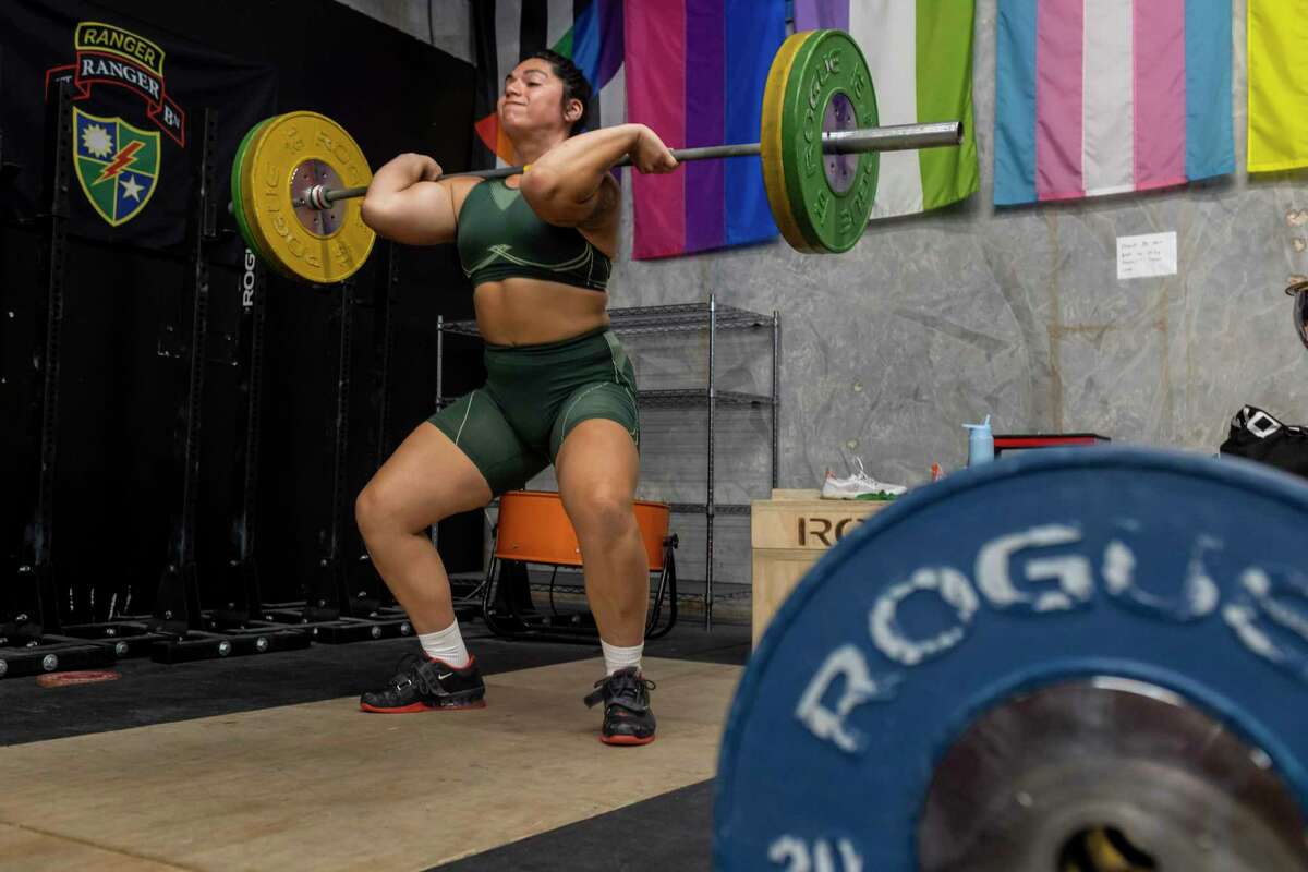 Weightlifter Angel Flores, 23, trains at Liberation Barbell Club in Austin, TX, on June 8, 2022. Flores came out as transgender two years ago after competing in weightlifting since she was young. “The biggest benefit that comes from sports is through involvement,” she said. “It’s not through winning. It’s not through major success. The benefits come from simply being in those sports spaces, doing what they love, being with their friends. Nobody should be denied access to the benefits and the community that sports brings. As an athlete my whole life, sport has taught me everything, how to build networks, how to be a team leader, how to continue to improve myself and have a work ethic. Without sport, I really wouldn’t know how to do any of those things.”