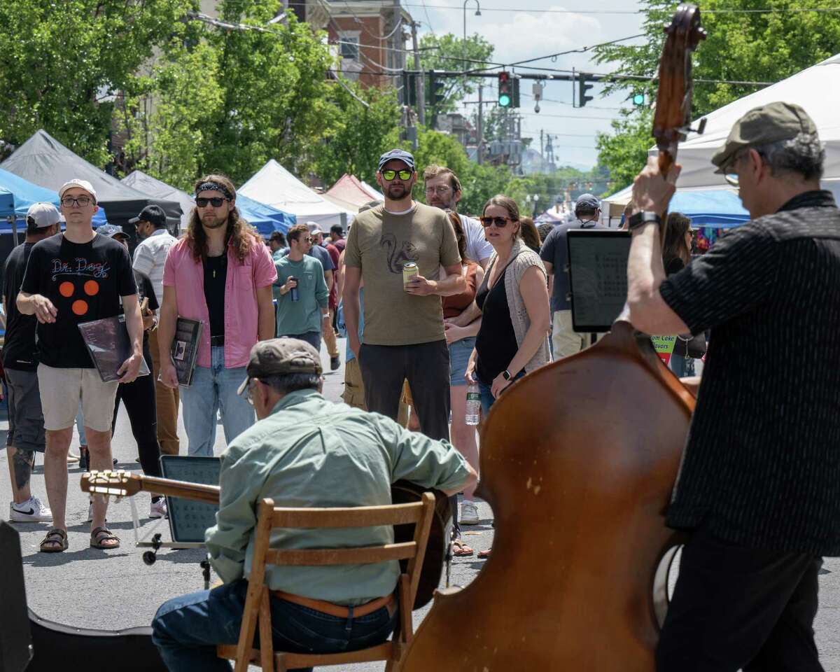 Revelers listen to Hot Tuesday during the Art on Lark street festival held on Lark Street on Saturday, June 11, 2022. (Jim Franco/Special to the Times Union)