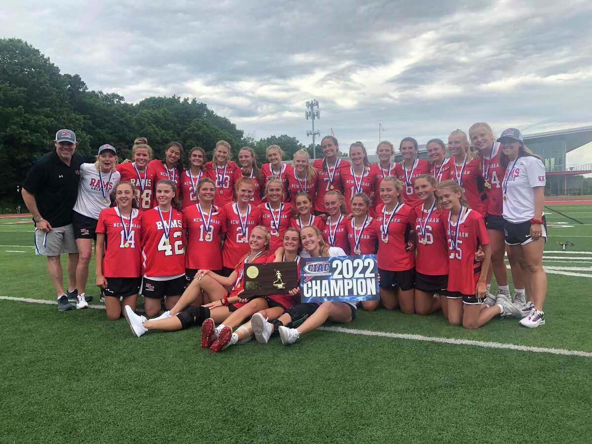 New Canaan celebrates its 14-13 win over Darien in the Class L girls lacrosse championship on Saturday, June 11, 2022 at Sacred Heart University in Fairfield, Conn.