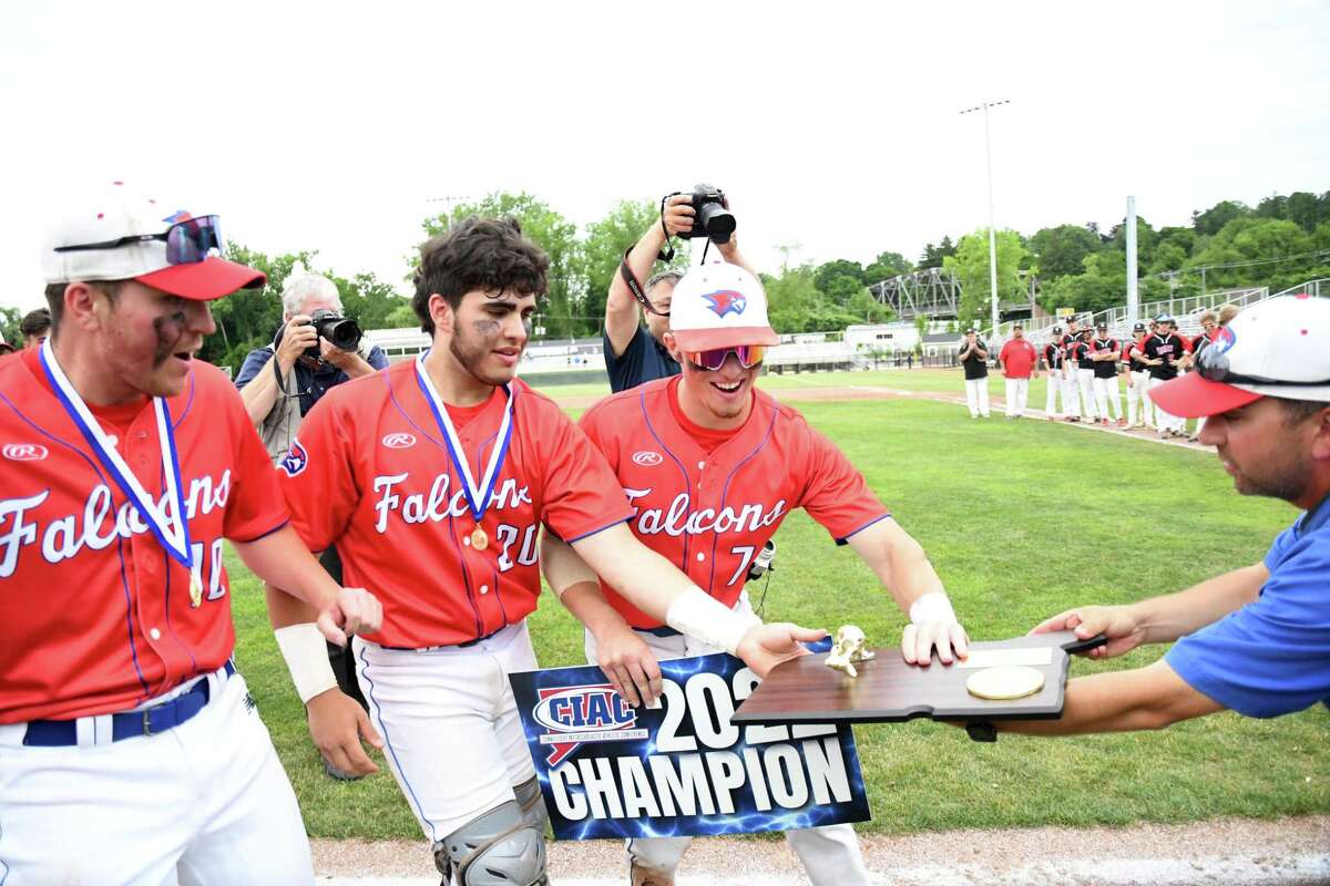 St. Paul's Ryan Daniels and Casey Cerruto grab the championship plaque after St. Paul beat Somers, 5-0 in the Class S baseball championship game at Palmer FIeld, Middletown on Saturday, June 11, 2022.