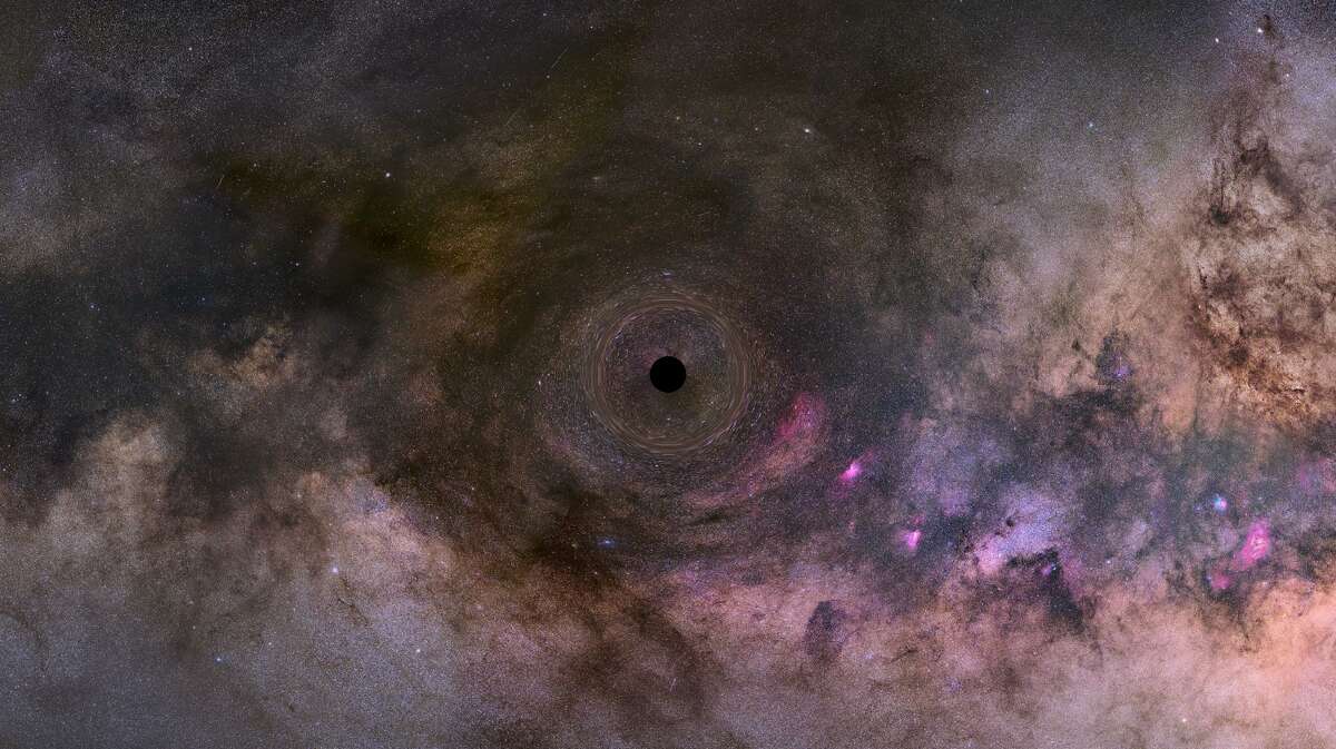 This is an illustration of a close-up look at a black hole drifting through our Milky Way galaxy.