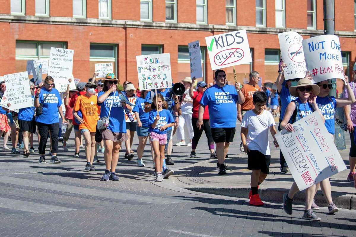 People march through downtown San Antonio during the March for Our Lives event Saturday, June 11, 2022. The march, one of about 300 occurring across the nation the same day, is a call to end gun violence in the wake of the Uvalde school shooting that left 19 children and two teachers dead and the shooting in Buffalo, N.Y.