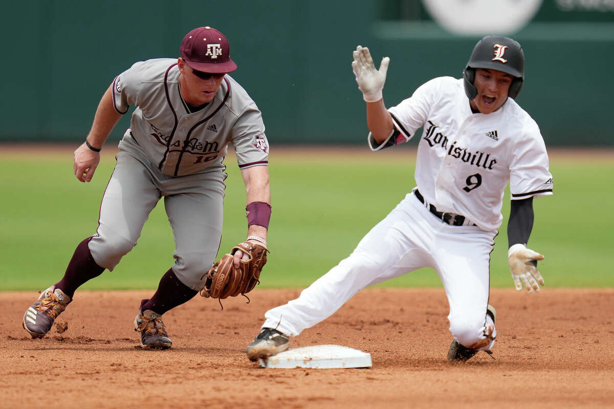 Louisville's Christian Knapczyk (9) reacts as he slides safely into second with a double as Texas A&M infielder Ryan Targac (16) tries to apply a late tag during an NCAA college baseball super regional tournament game Saturday, June 11, 2022, in College Station, Texas. (AP Photo/Sam Craft)