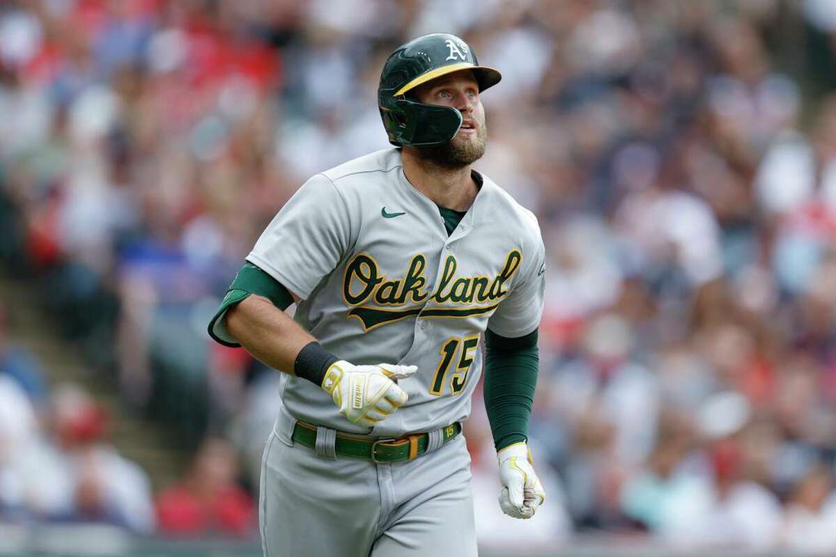 Oakland Athletics' Seth Brown watches his grand slam off Cleveland Guardians relief pitcher Eli Morgan during the seventh inning of a baseball game, Saturday, June 11, 2022, in Cleveland. (AP Photo/Ron Schwane)