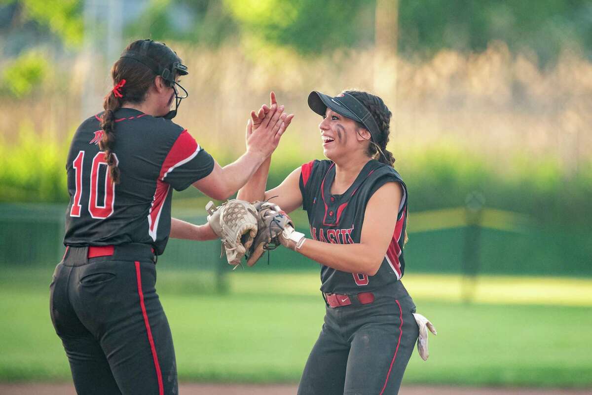 Masuk High's Kathryn Gallant and Julia Bacoulis celebrate with one out remaining against Waterford High during the 2022 CIAC Class L softball championship at DeLuca Field in Stratford, CT.