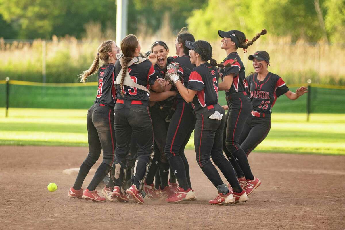 Masuk High celebrates after winning the 2022 CIAC Class L softball championship against Waterford High at DeLuca Field in Stratford, CT.