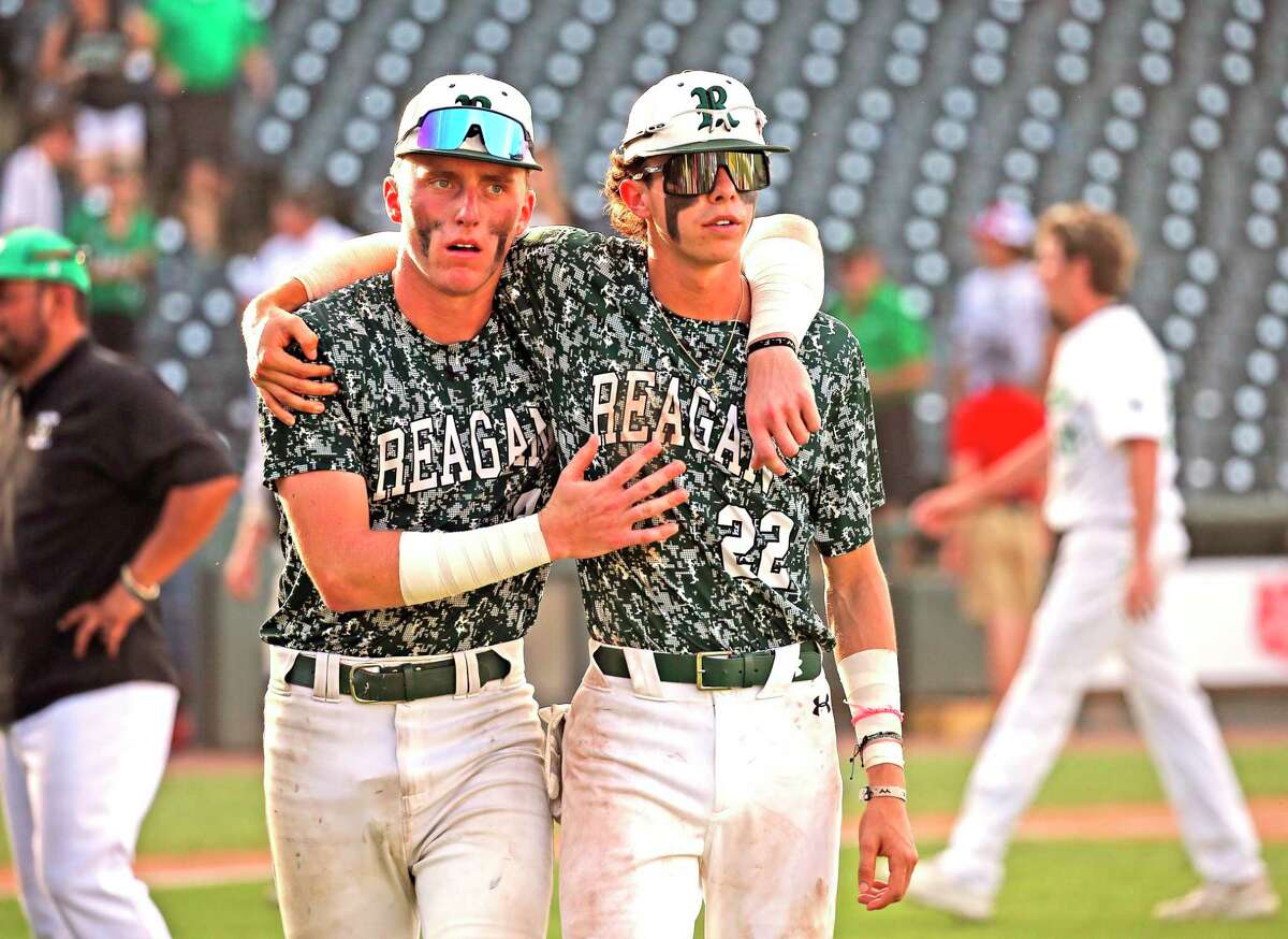 Reagan Andrew Ermis (3) walks off with teammate Jack Allison (220 at the end of the game. Southlake Carrol defeated Reagan 8-5 in 6A baseball Championship on Satuirday, June 11, 2022 at Dell Stadium.