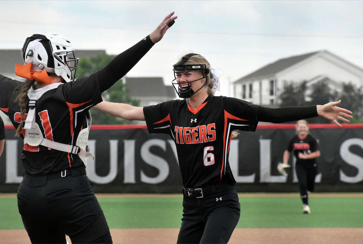 Edwardsville's Ryleigh Owens celebrates the win with a hug for Lexie Griffin against Barrington during the third-place game of the Class 4A state tournament at the Louisville Slugger Sports Complex on Saturday in Peoria.