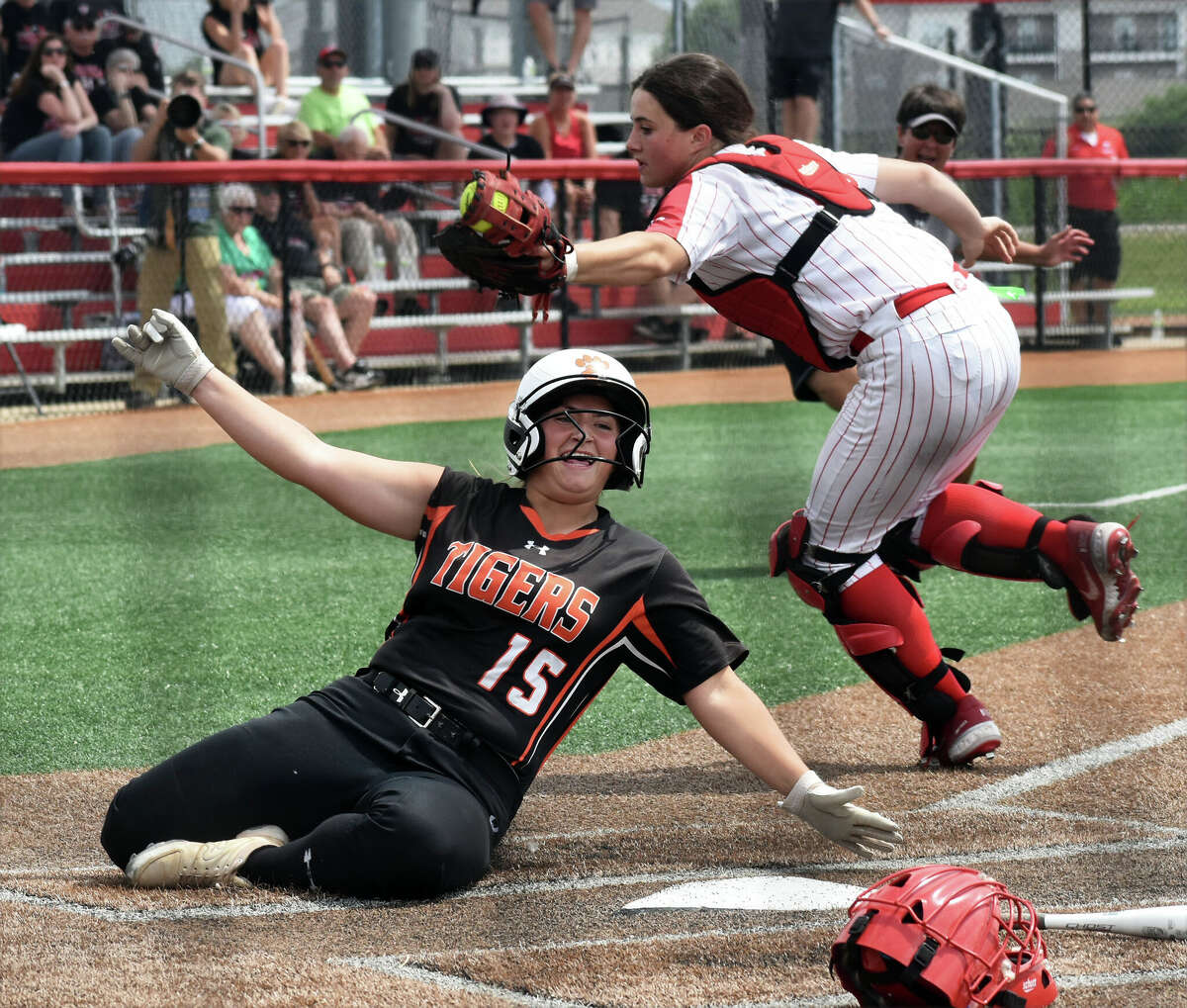Edwardsville's Sydney Lawrence slides across home plate against Barrington during the third-place game of the Class 4A state tournament at the Louisville Slugger Sports Complex on Saturday in Peoria.