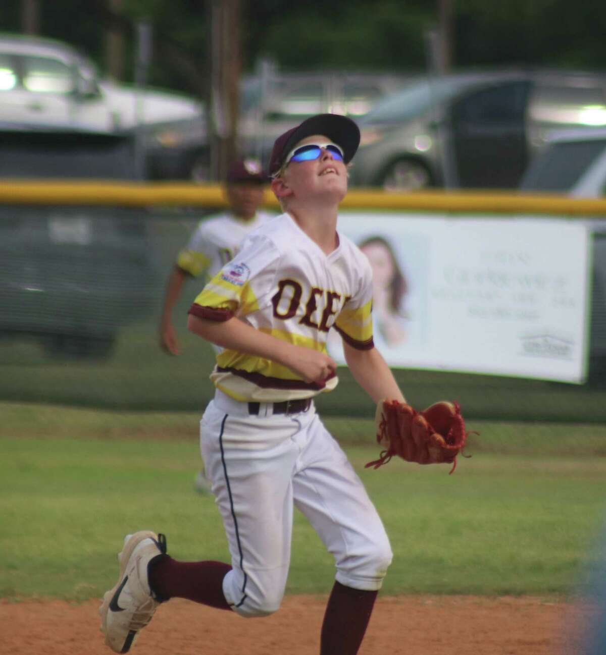 Deer Park Bronco all-star Cody Hickman tries to find an infield fly ball Saturday afternoon against a Friendswood team. Cody is back on the diamond at noon Sunday, looking for a berth in Monday's title game.