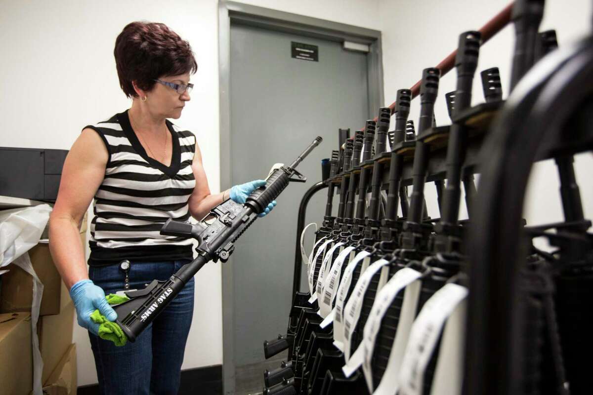 Teresa Adamczyk inspects goods at Stag Arms, a gun manufacturer, in New Britain, Conn., May 21, 2013. (James Estrin/The New York Times)