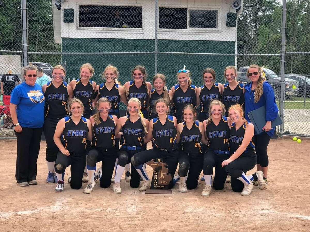 Evart's softball team shows off its regional championship trophy on Saturday.