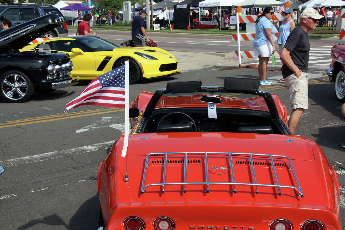A 1969 Chevrolet Corvette, foreground, with a much more recent (2014-2019) model in the background at the Edwardsville Route 66 Festival Saturday.
