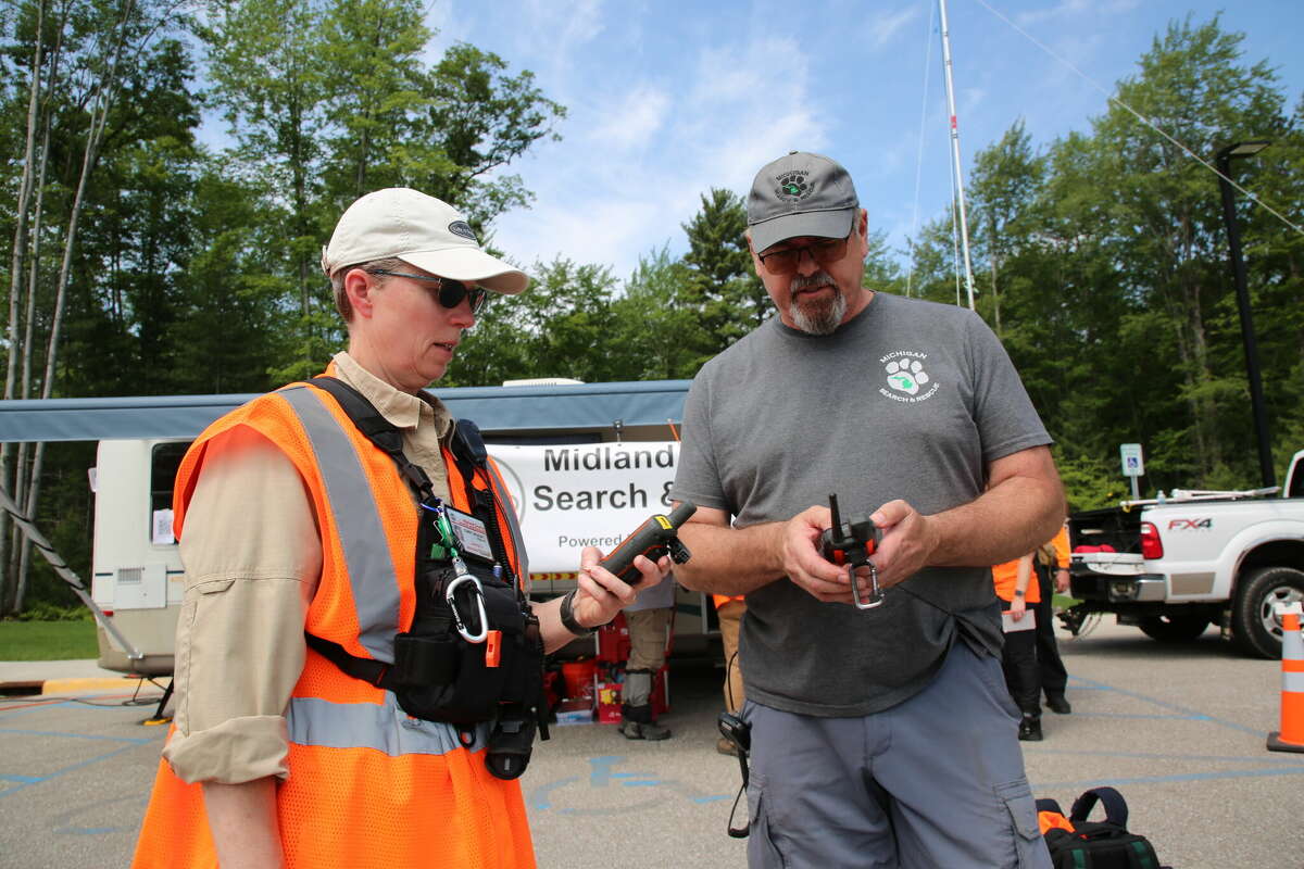 Members of the Midland County Search and Rescue team Cindy Vickery and Todd Rockwell conduct drills in Sanford June 11, 2022