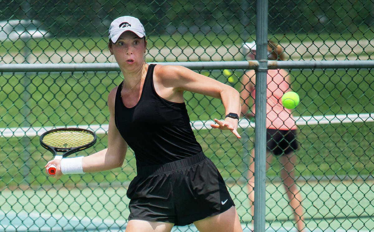 Samantha Mannix of Iowa City, Iowa, winds eyes the ball en route to her Women's Ooen Singles championship Sunday over Sampada Coster of St. Louis in the Bud Simpson Open at The Andy Simpson Tennis Complex Lewis and Clark Community College. 