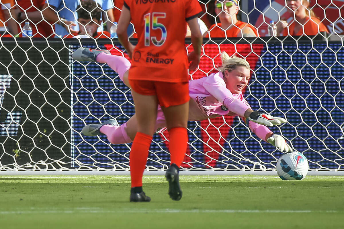 HOUSTON, TX JUNE 12: Houston Dash goalkeeper Jane Campbell (1) traps the ball in the first half during the NWSL soccer match between the Portland Thorns and Houston Dash at PNC Stadium in Houston, Texas.