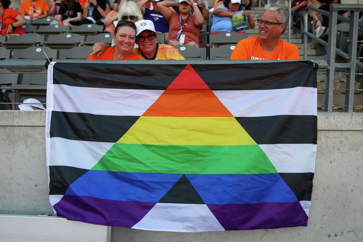 HOUSTON, TX JUNE 12: Soccer fans fly Pride flags during the NWSL soccer match between the Portland Thorns and Houston Dash at PNC Stadium in Houston, Texas.
