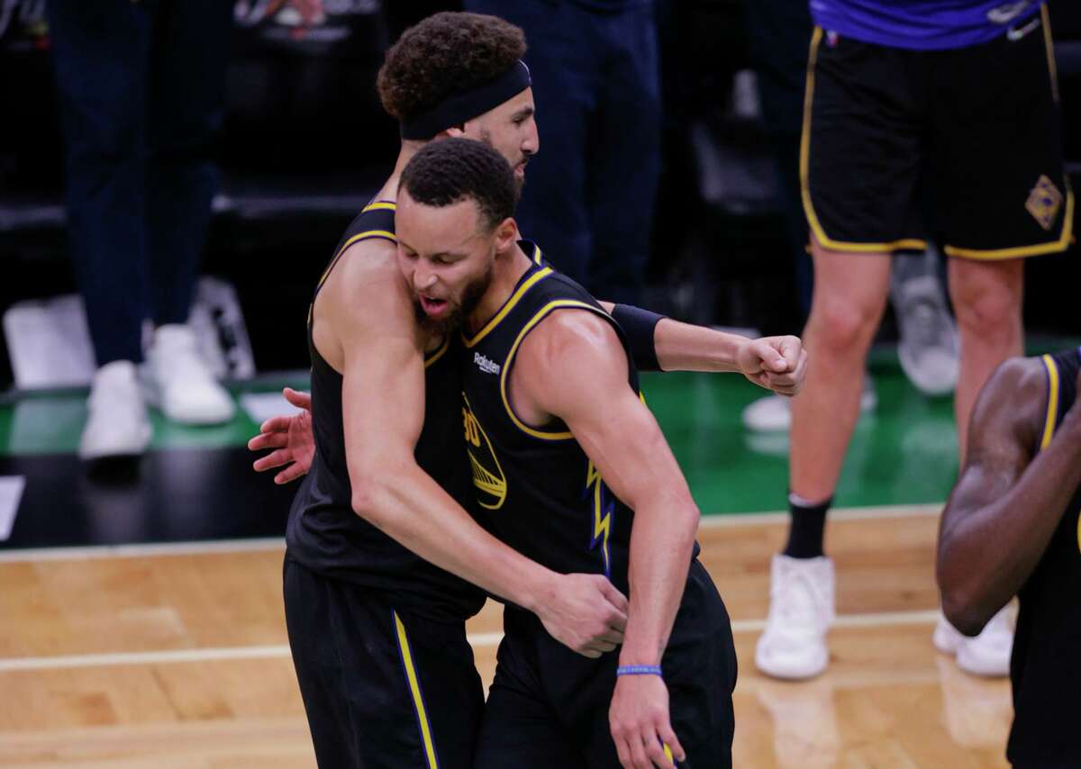 The Warriors’ Stephen Curry (right) and Klay Thompson were able to celebrate after beating the Celtics in Game 4.