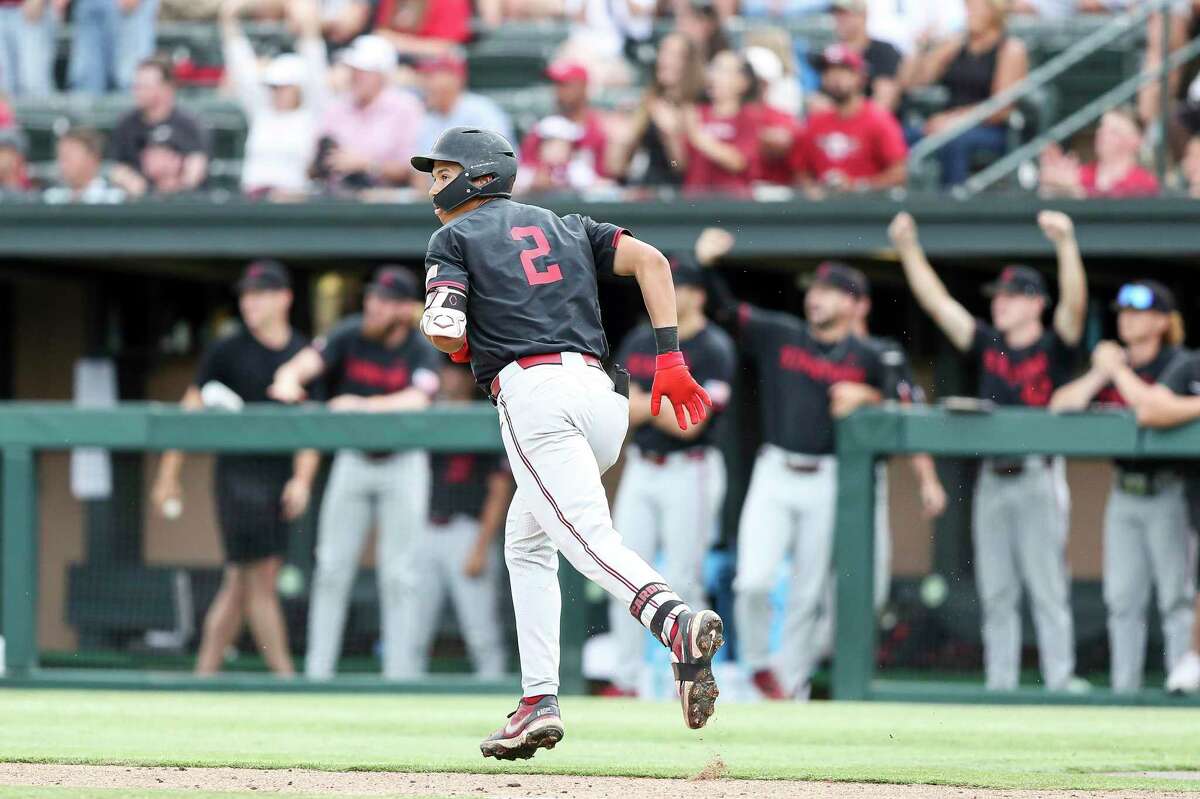 Stanford's Drew Bowser watches his solo home run against Connecticut in the second inning of an NCAA college baseball super regional game Sunday, June 12, 2022, in Stanford, Calif. (AP Photo/Kavin Mistry)