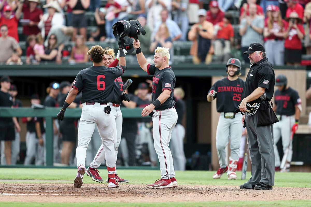 Stanford's Braden Montgomery (6) celebrates with Carter Graham, right, and Brett Barrera after hitting a three-run home run against UConn on Sunday.
