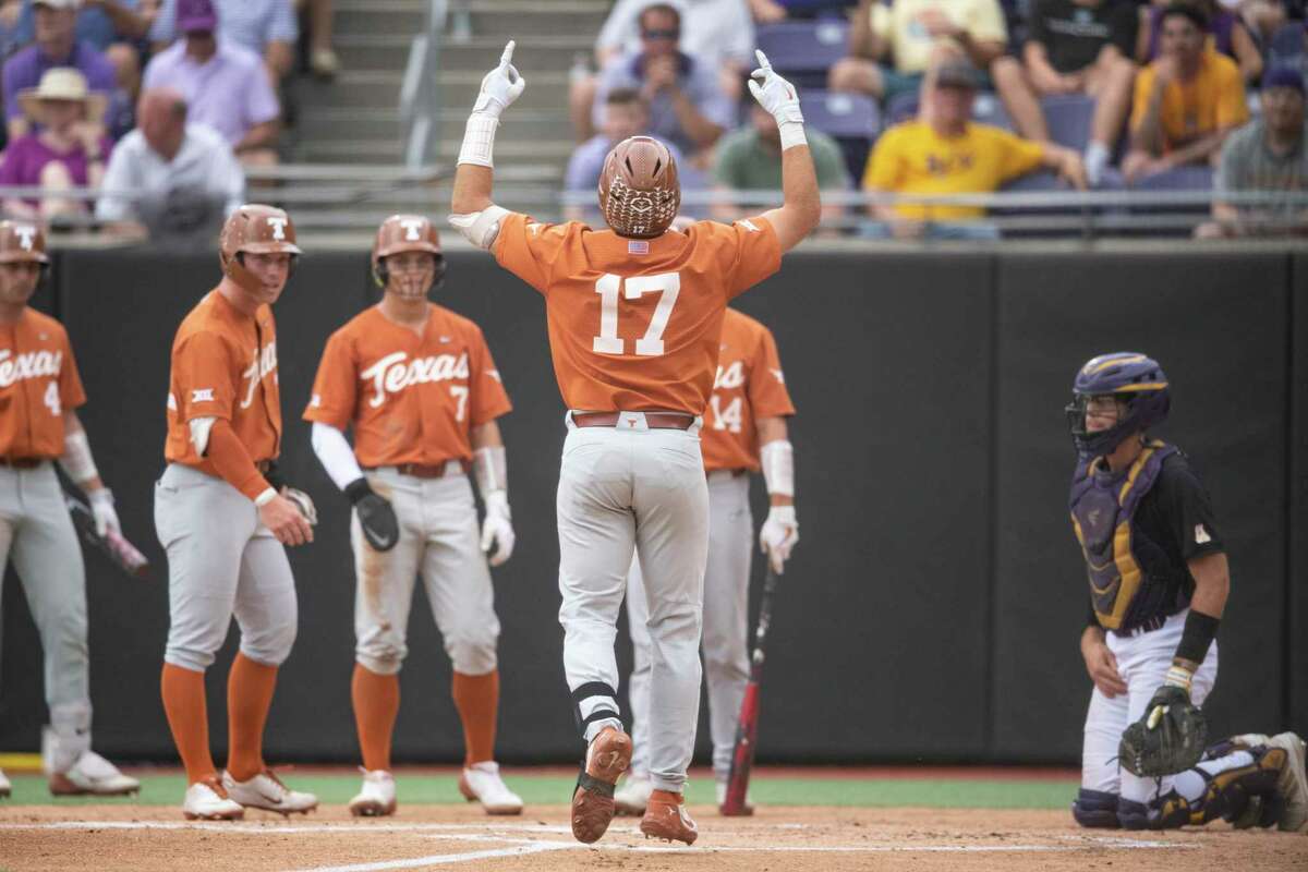 Texas’ Ivan Melendez gestures at home plate after hitting a three-run home run during the first inning of an NCAA college super regional baseball game against East Carolina on Sunday, June 12, 2022, in Greenville, N.C.