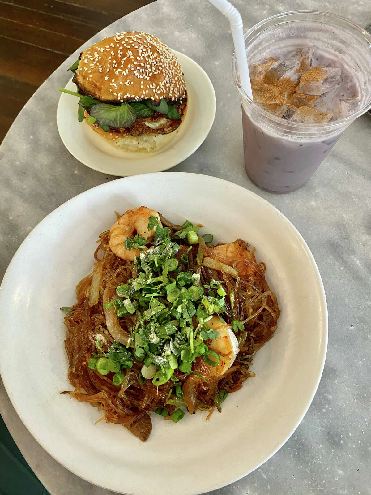 Clockwise from top left, Morningbird's breakfast sandwich, black-rice horchata and glass noodles with mushrooms, scallions and shrimp.