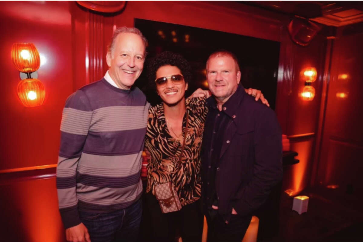 Jim Gray, Bruno Mars and Tilman Fertitta attend the grand opening party of Catch Steak LA.