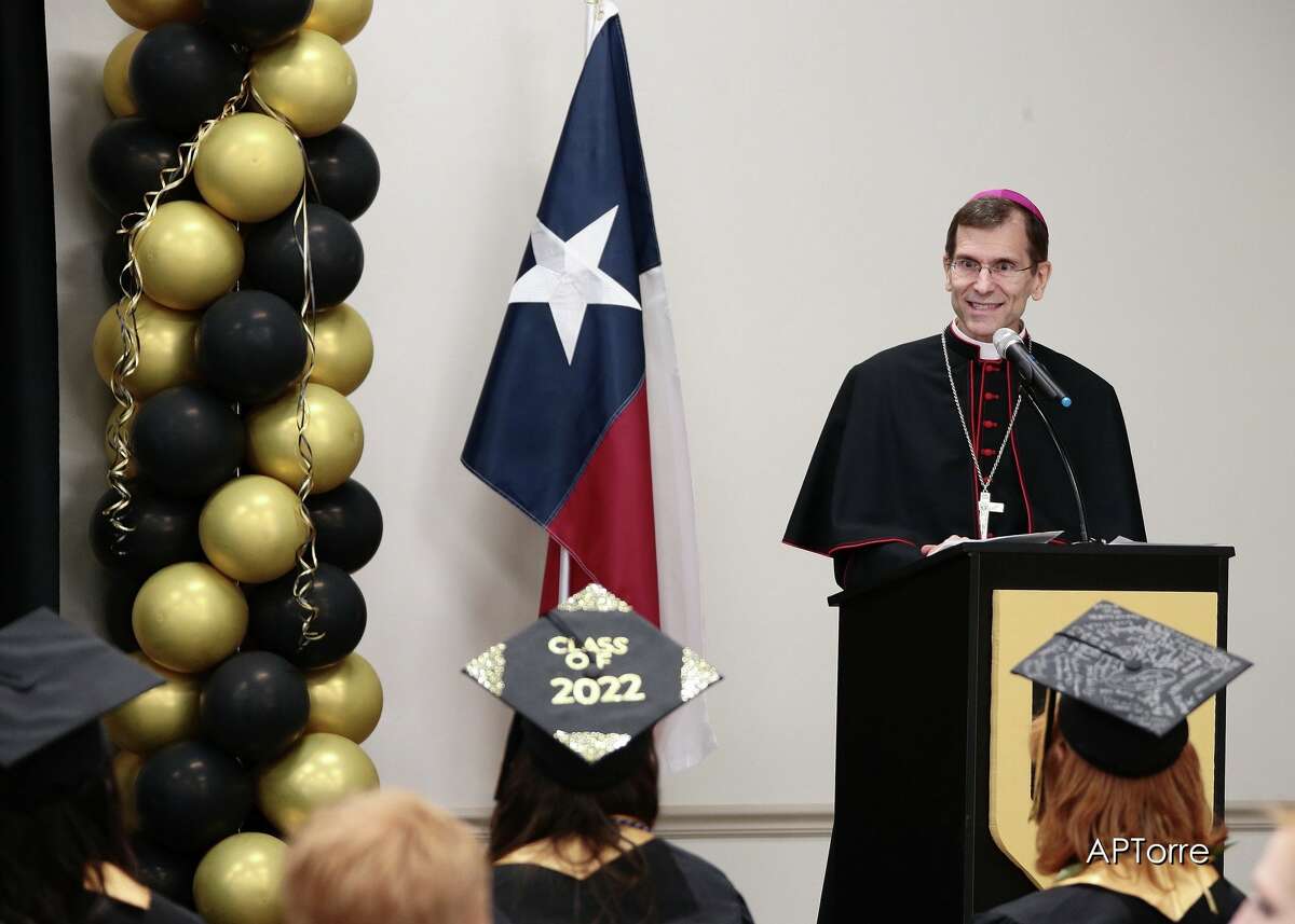 Bishop Sis speaks at Holy Cross High School's graduation ceremony.