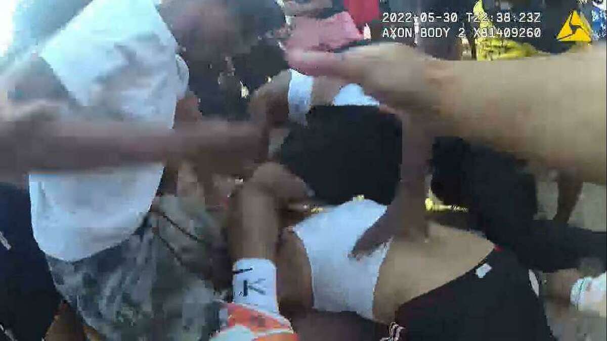 Milford police said three juveniles have been arrested in connection with a brawl on Walnut Beach on Monday, May 30, 2022. Above, an image from body camera footage of the incident.