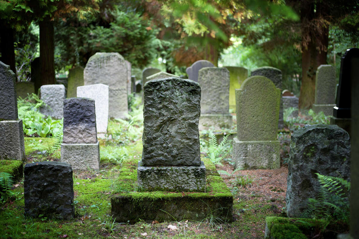 STOCK IMAGE  Rows of very old and weathered tombstones
