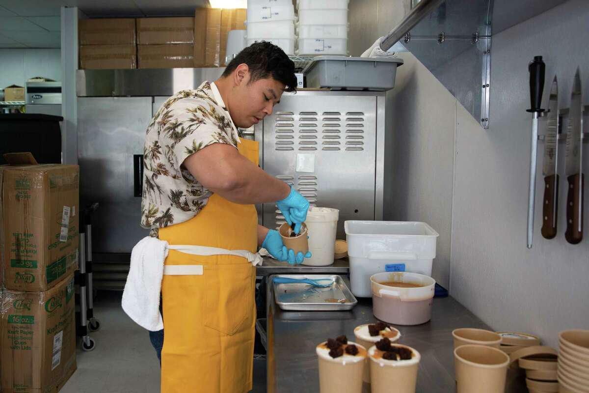 Underground Creamery owner Josh De Leon, 31, packages Miso Banana Brownie Caramel ice cream Thursday, June 9, 2022, in Houston. De Leon started making ice cream in 2018. Today, he's making 400 pints for a customer base of 4,000 from the kitchen he shares with Pudgy’s Fine Cookies.