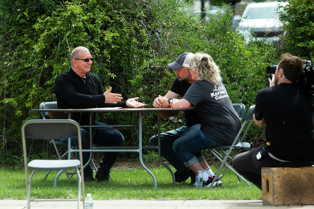 Chef Robert Irvine, left, chats with Chris and Leah Fogle, right, owners of Leah's Korner Kafe, while the crew films an episode of "Restaurant: Impossible" Monday, June 13, 2022 in Coleman.