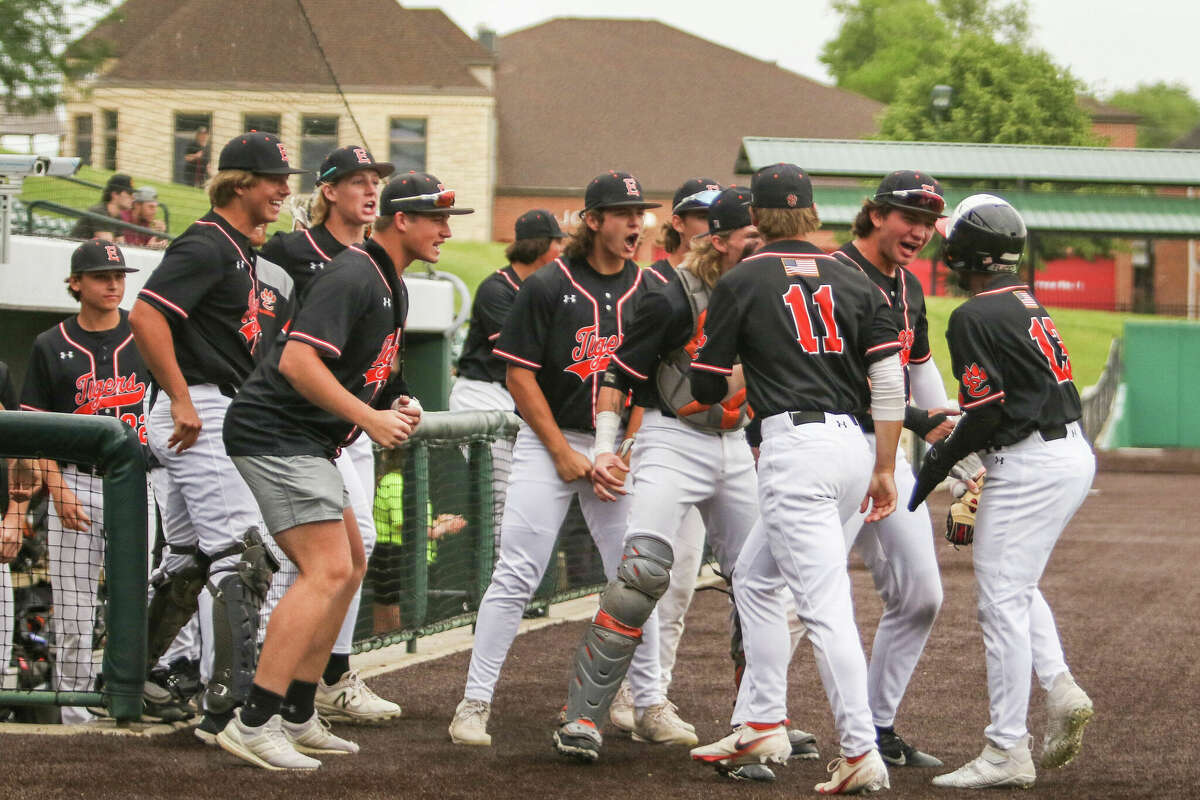 The Edwardsville dugout welcomes Montrez West after he he steals home against Brother Rice in the Class 4A state semifinal game. The run was the go-ahead run en route to a 7-4 Edwardsville win. 