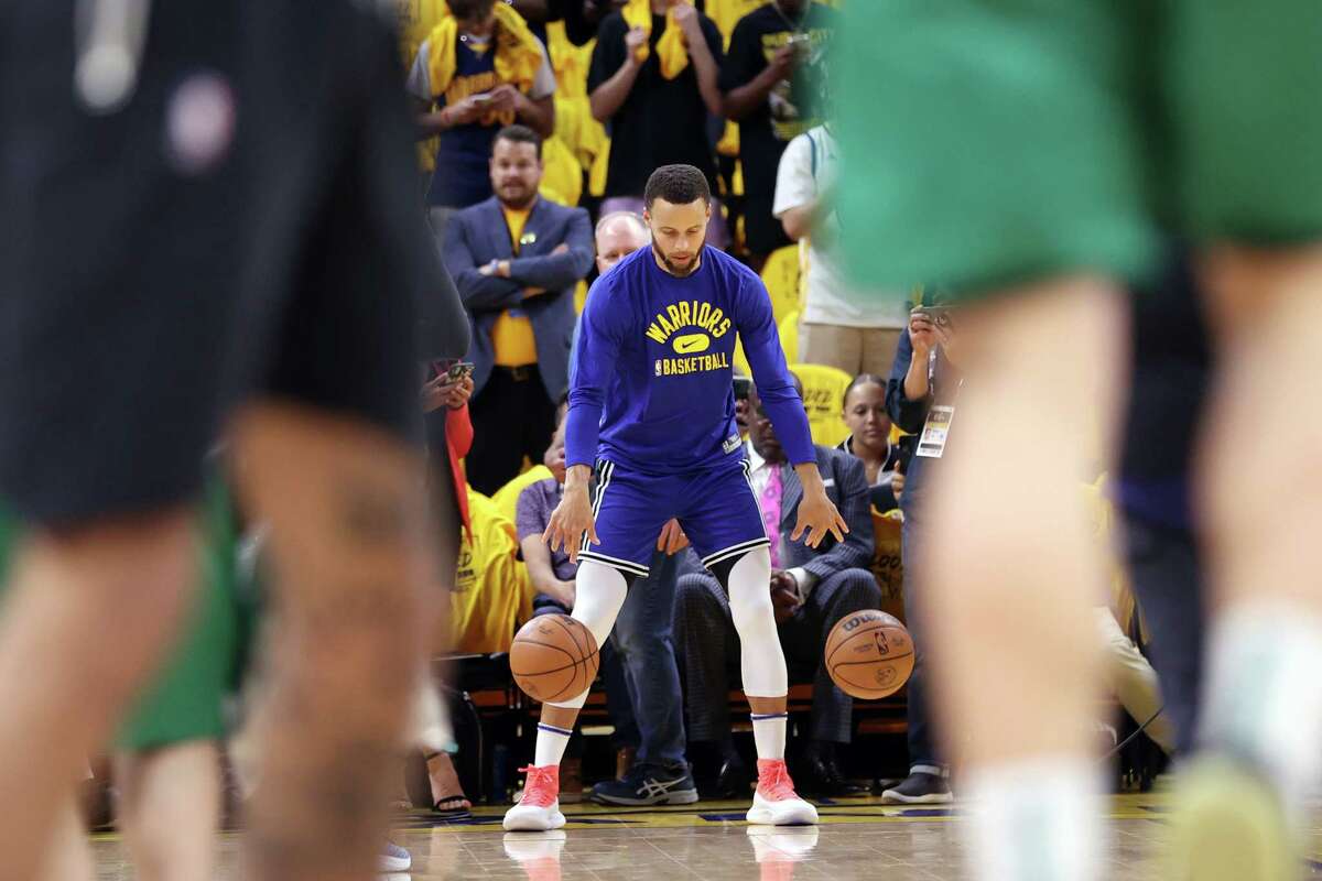 Golden State Warriors’ Stephen Curry goes through his pregame routine before playing Boston Celtics in Game 5 of NBA Finals at TD Garden in San Francisco, Calif.,, on Monday, June 13, 2022.