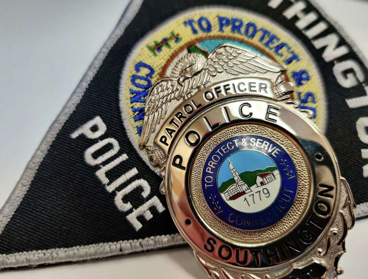 A file photo of a Southington, Conn., police badge. Police are looking for a man suspected of stabbing a driver on Interstate 84 over the weekend.