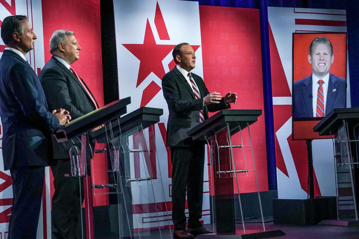 Former Westchester County Executive Rob Astorino, far left, businessman Harry Wilson, second from left, Suffolk County Congressman Lee Zeldin, second from right, and Andrew Giuliani, far right, son of former New York City Mayor Rudy Giuliani, face off during New York's Republican gubernatorial debate at the studios of CBS2 TV, Monday, June 13, 2022, in New York. Giuliani participated via virtual broadcast after he was blocked from the studios for not meeting vaccine requirements. On Tuesday, he was allowed to appear in person for the final GOP debate. (AP Photo/Bebeto Matthews)  