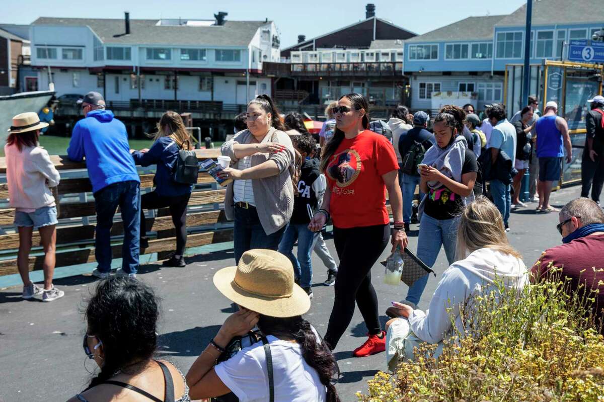 Crowds flock to Pier 39 on the first day of COVID-19 restrictions being lifted in San Francisco, June 15, 2021. That day marked a key milestone in reopening efforts for the state and the Bay Area, but the coronavirus has maintained a course of its own.