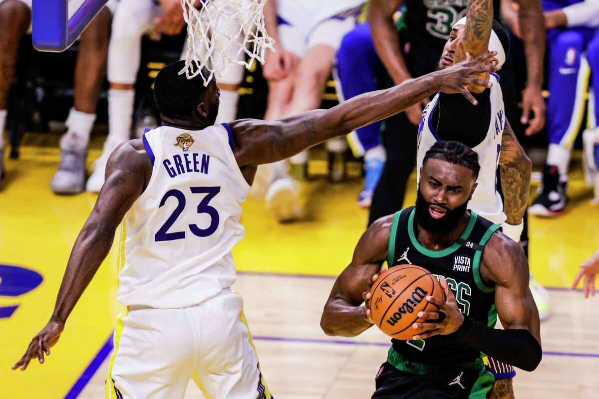 Golden State Warriors' Draymond Green, 23, stops Boston Celtics' Jaylen Brown, 7, during the second quarter in Game 5 of the NBA Finals at Chase Center in San Francisco, Calif., on Monday, June 13, 2022.