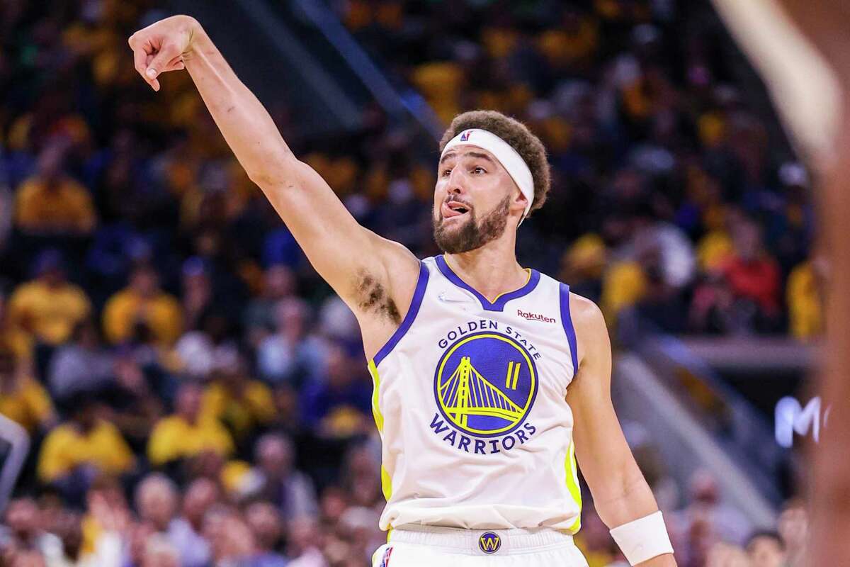 Golden State Warriors' Klay Thompson, 11, watches a three point attempt during the third quarter in Game 5 of the NBA Finals at Chase Center in San Francisco, Calif., on Monday, June 13, 2022.