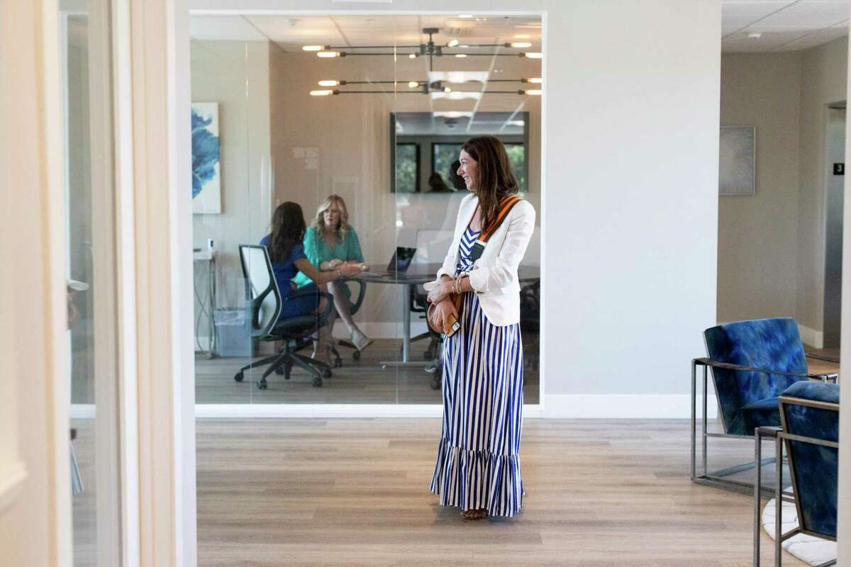 Real estate agent Dara Buzzard talks with a colleague at Dudum Real Estate Group in Danville. The independently owned brokerage has four offices in the East Bay and one at Lake Tahoe. “There were daily Zoom meetings within our company because there was so much changing,” Dudum agent Angie Clay said.