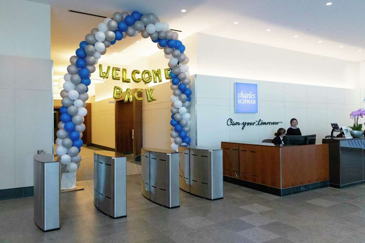 The lobby of the San Francisco office of Charles Schwab is seen with balloons welcoming employees back to in-person work. The financial giant was founded in San Francisco.