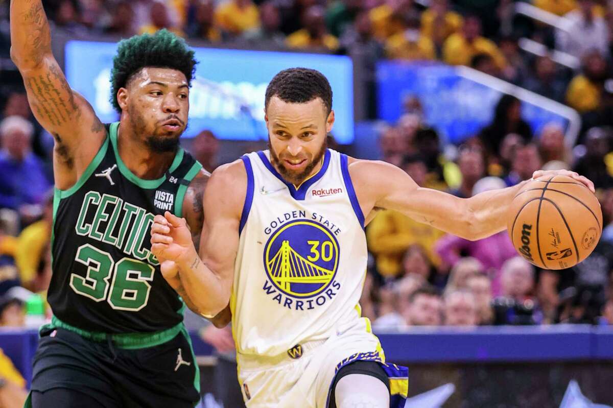 Golden State Warriors' Stephen Curry, 30, tries to get past Boston Celtics' Marcus Smart, 36, during the third quarter in Game 5 of the NBA Finals at Chase Center in San Francisco, Calif., on Monday, June 13, 2022.