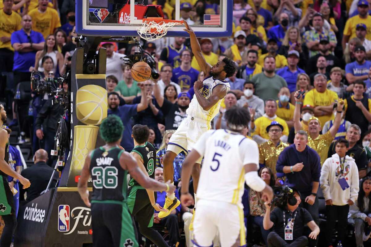 Golden State Warriors’ Andrew Wiggins dunks in 4th quarter of Warriors’ 104-94 win over Boston Celtics in Game 5 of NBA Finals at TD Garden in San Francisco, Calif.,, on Monday, June 13, 2022.