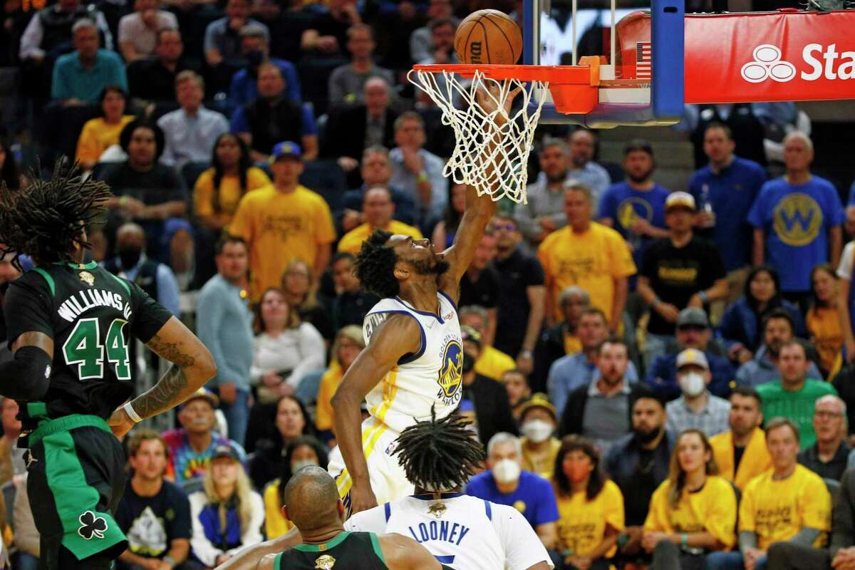 Golden State Warriors forward Andrew Wiggins (22) scores against the Boston Celtics during the fourth quarter in Game 5 of the NBA Finals at Chase Center, Monday, June 13, 2022, in San Francisco, Calif.