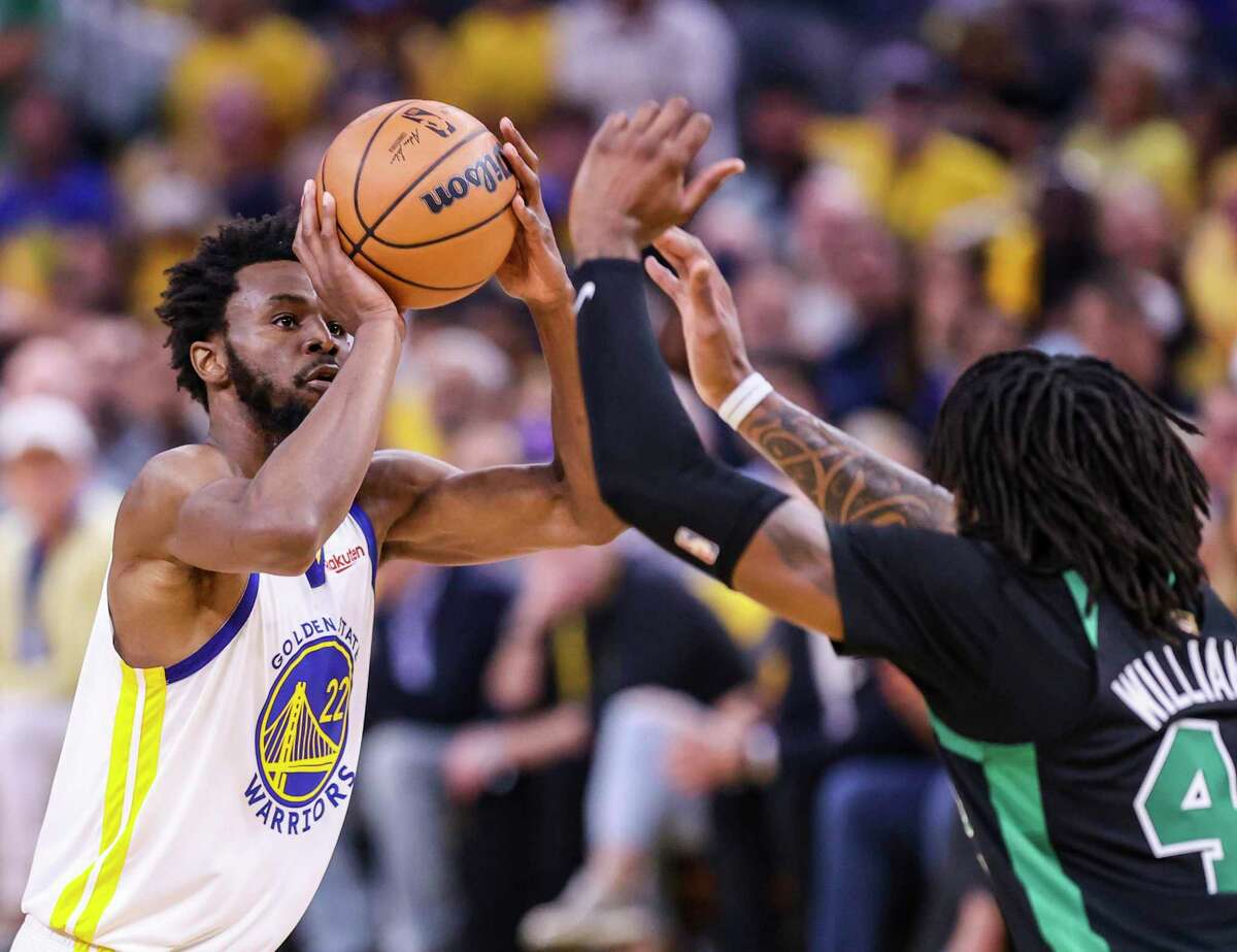 Golden State Warriors' Andrew Wiggins, 22, shoots over Boston Celtics' Robert Williams III, 44, during the second quarter in Game 5 of the NBA Finals at Chase Center in San Francisco, Calif., on Monday, June 13, 2022.