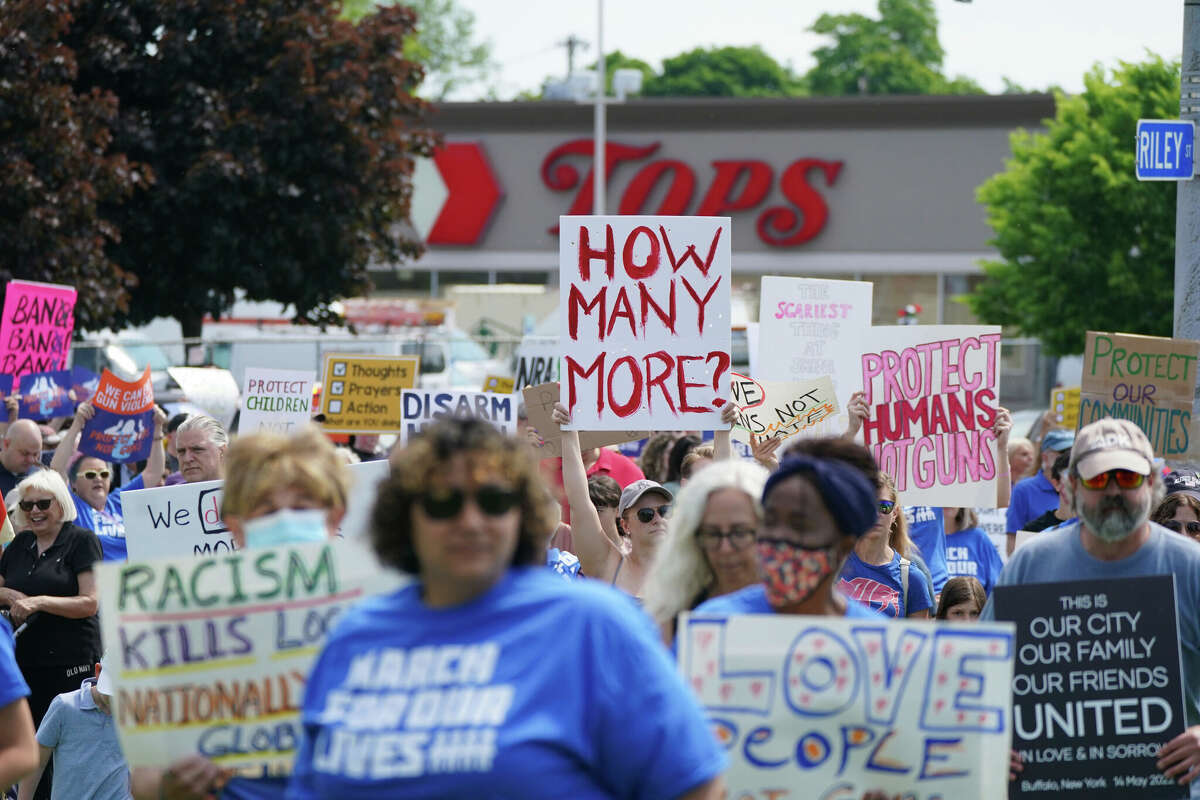 Protesters march down Jefferson Avenue past the site of the Tops massacre during a March for Our Lives rally in support of gun control, Saturday, June 11, 2022, in Buffalo, N.Y. 