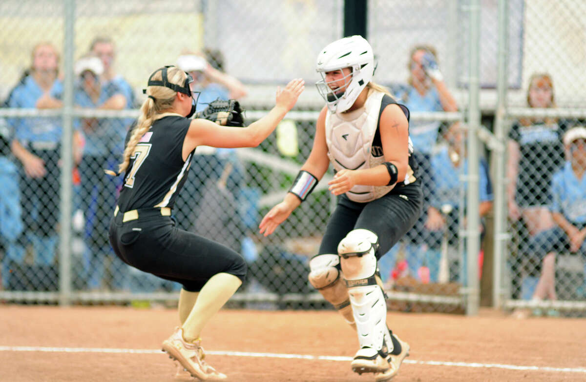 Woodland pitcher Samantha Sosnovich (7), left, and catcher Kylie Bulinski (12) celebrate the team's win over Oxford in CIAC Class M state championship softball at DeLuca Field in Stratford, Conn., on Saturday June 11, 2022.