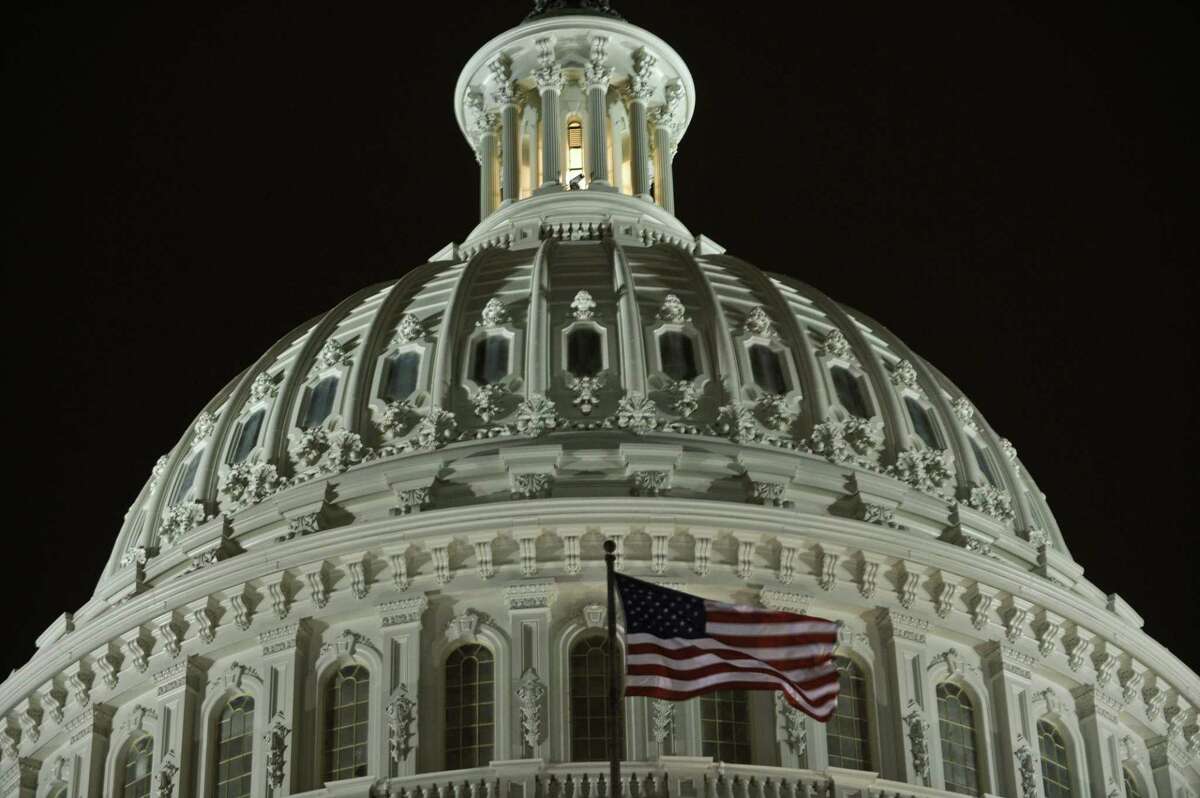The US Capitol is seen in Washington on January 24, 2011, one day before President Barack delivers his State of the Union speech. Obama faced a US public hungry for jobs and Republicans eager to oust him in 2012 as he readied his yearly State of the Union speech in a tense new era of power-sharing. Obama steps up at 9:00 pm Tuesday (0200 GMT Wednesday) to address a joint session of Congress and a television audience in the tens of millions -- his highest profile shot at defining his reinvigorated, retooled presidency. AFP PHOTO/Nicholas KAMM (Photo credit should read NICHOLAS KAMM/AFP/Getty Images)
